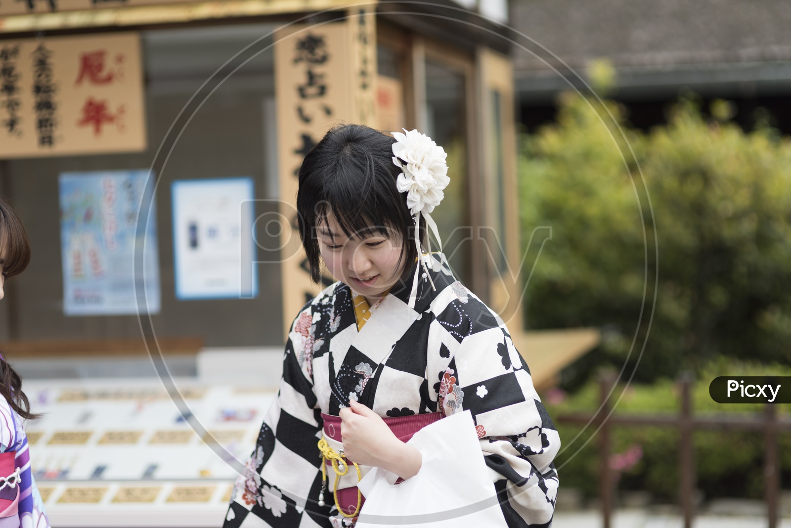 A Japanese Woman wearing black and white costume