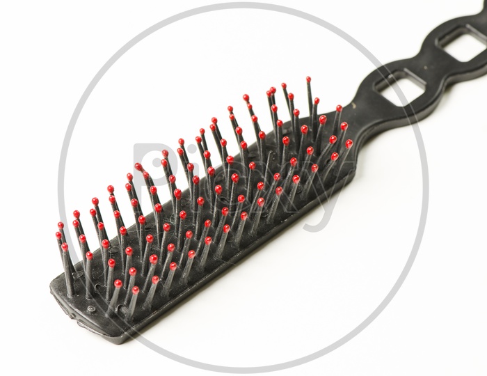 A Comb brush with red brittles