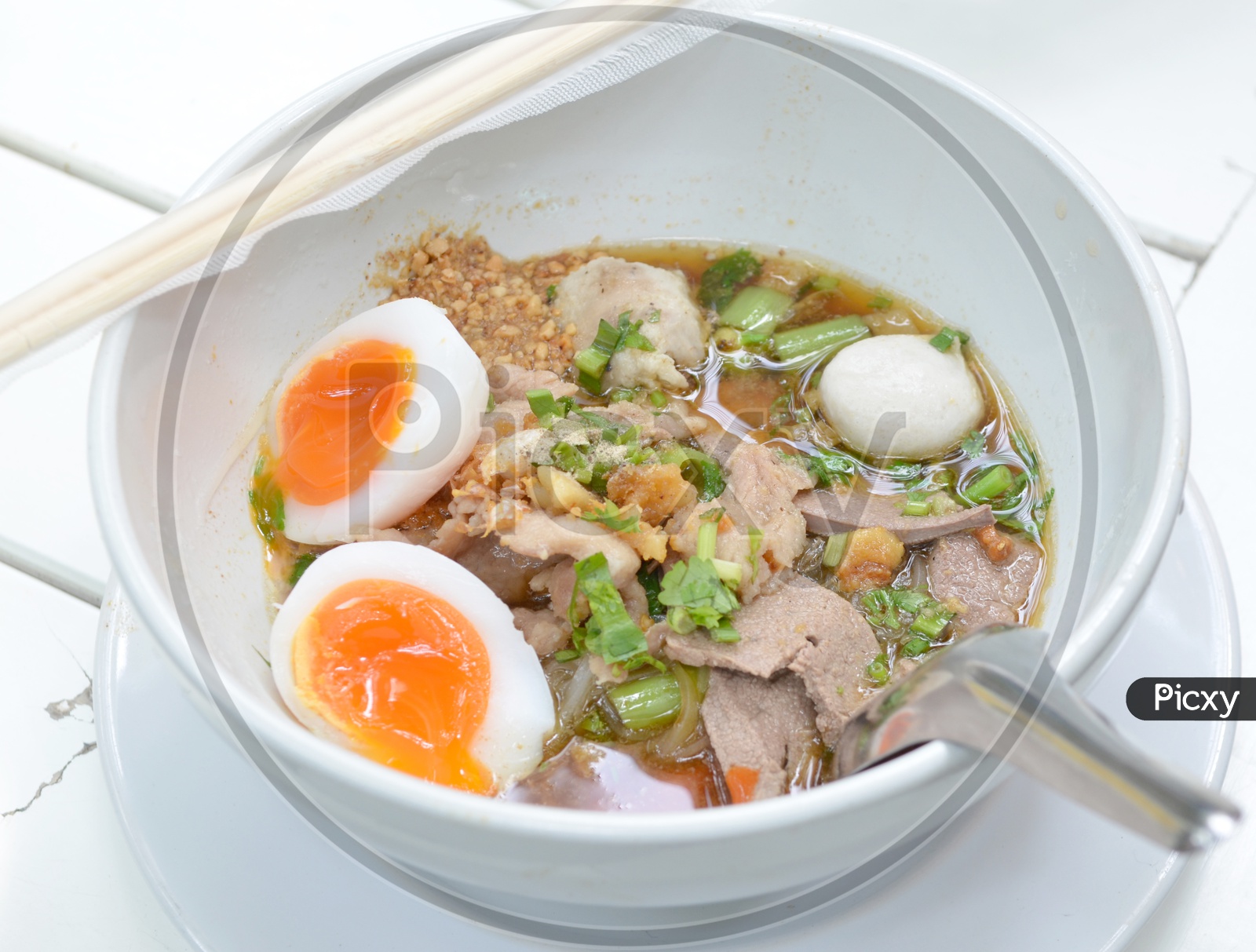 Thai pork Noodles with Boiled egg in a bowl