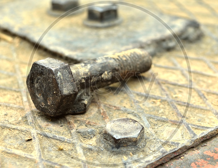 A rusted old iron nut