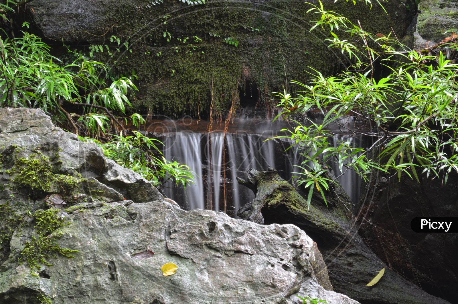 Long Exposure Shot of Erawan Waterfalls With Smooth Silky Texture Of Water Flowing
