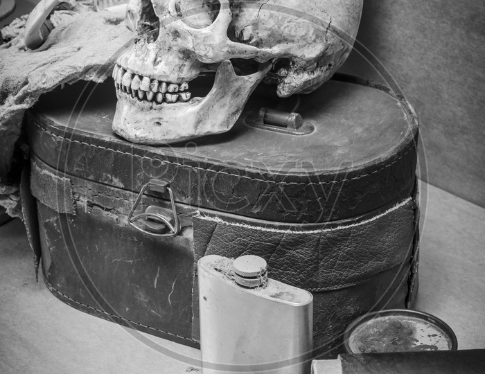 Still life with human skull with old Items in black and white Filter