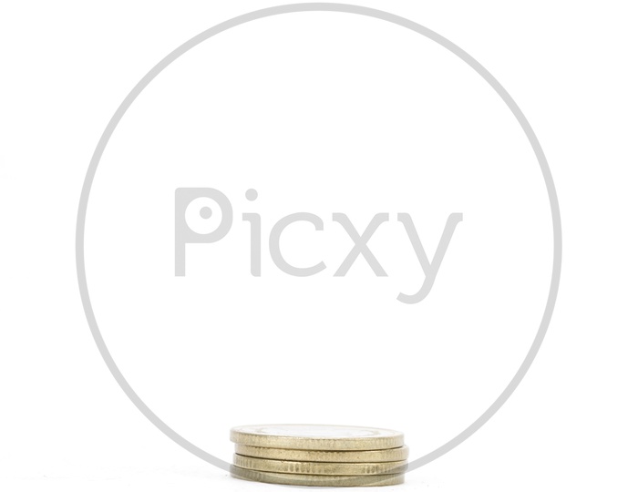 Golden Currency Coins Small  Column On an isolated White Background
