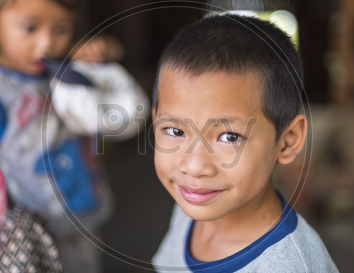 Image of Portrait of a Burmese Kid with Cap at Mandalay, Myanmar ...