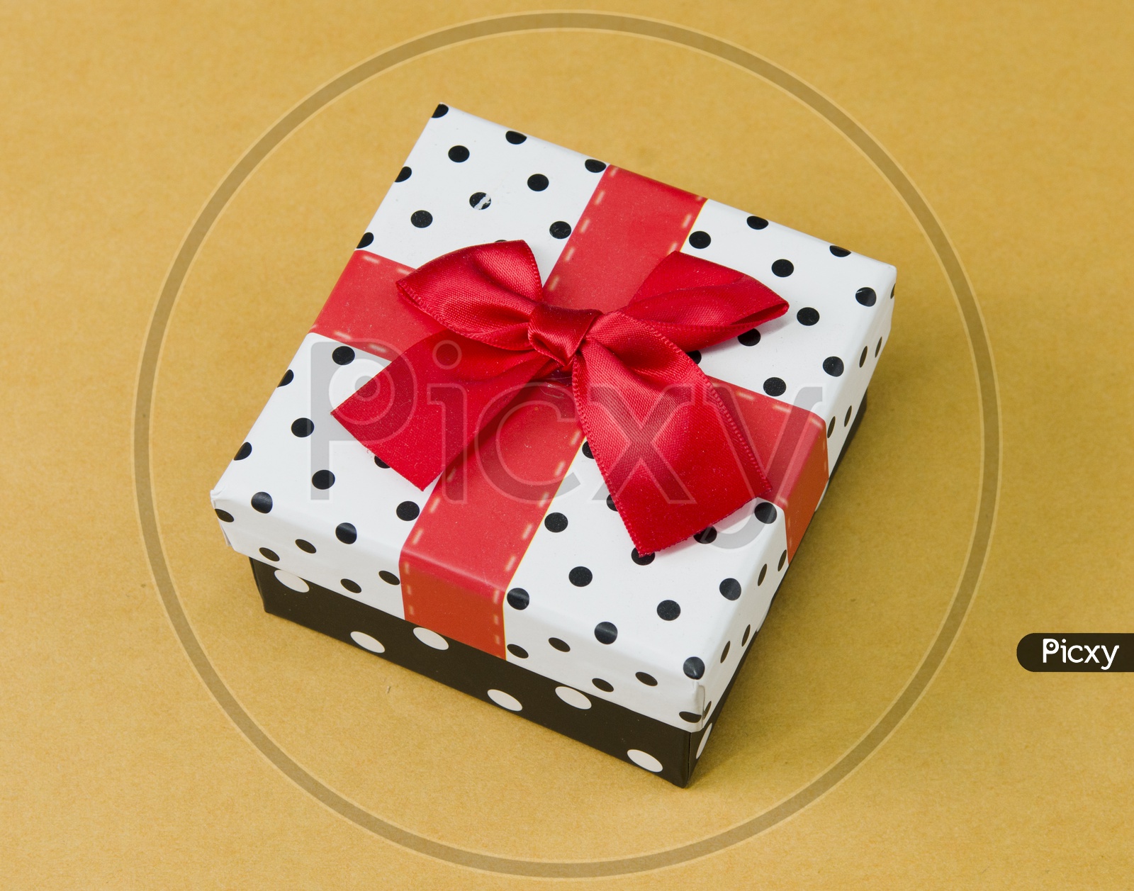 A gift box with ribbon tied