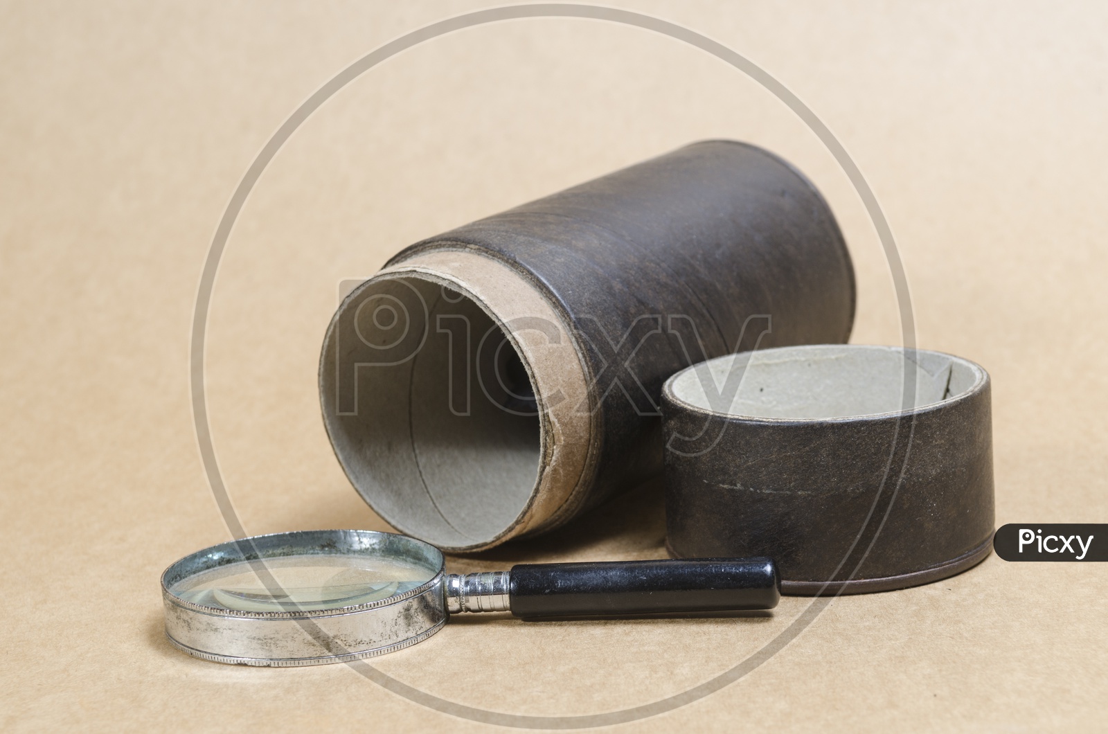 Magnifier and old items on Wooden Background
