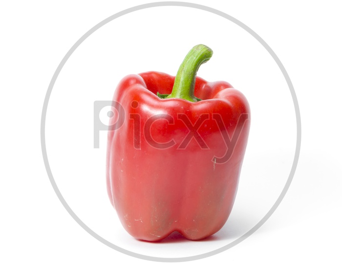 Bright red pepper isolated on white background