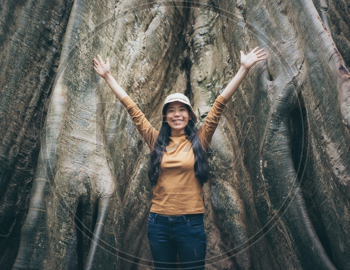 Asian woman cheering in the Thai Forest