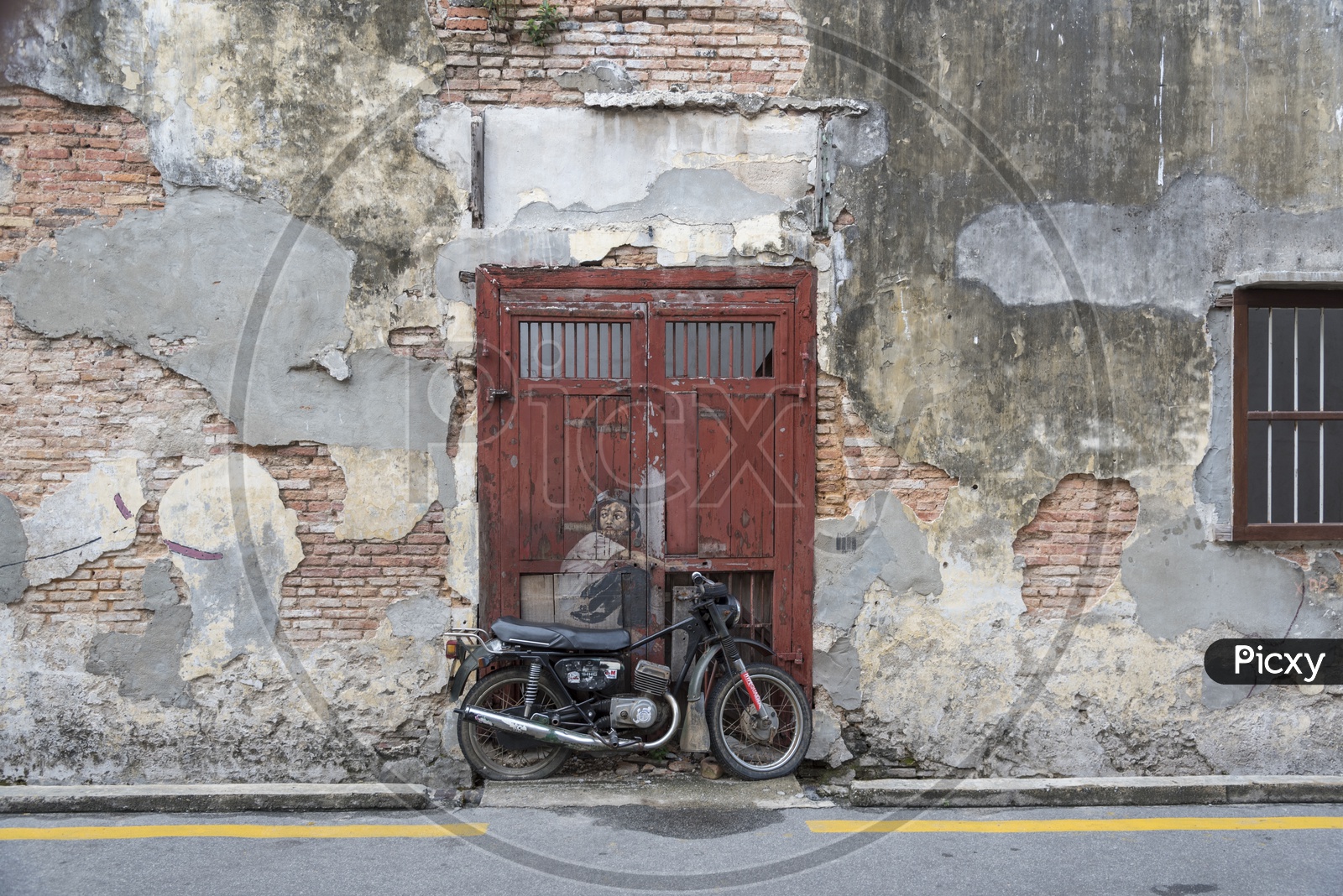 "Little Boy With Pet Dinosaur" street art on wall by Lithuanian artist Ernest Zacharevic in George Town, Penang, Malaysia.