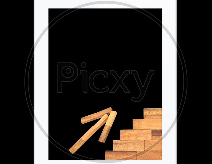 Tablet With Growth Concept with Wooden Blocks on an Isolated Black Background