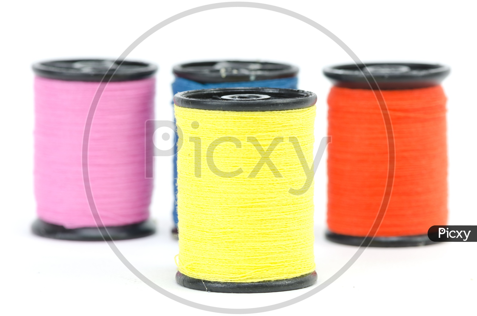 Colourful Sewing Thread Rolls Isolated Over an White Background
