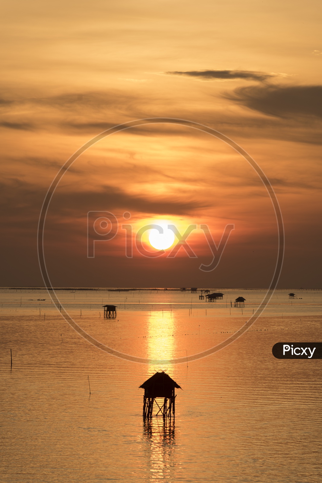 Fishermen house in the middle of Thailand sea during sunset