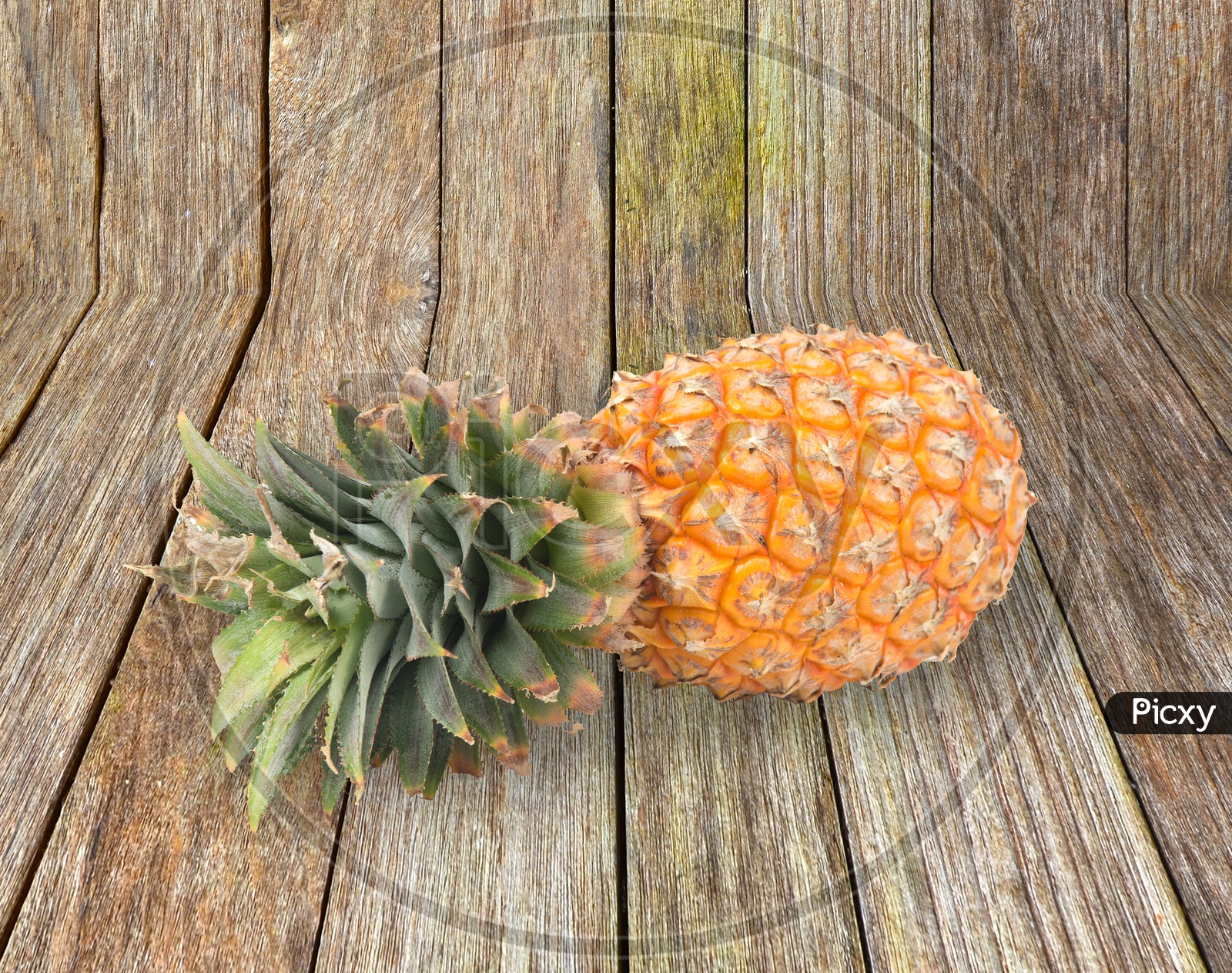 fresh pineapple on wood background