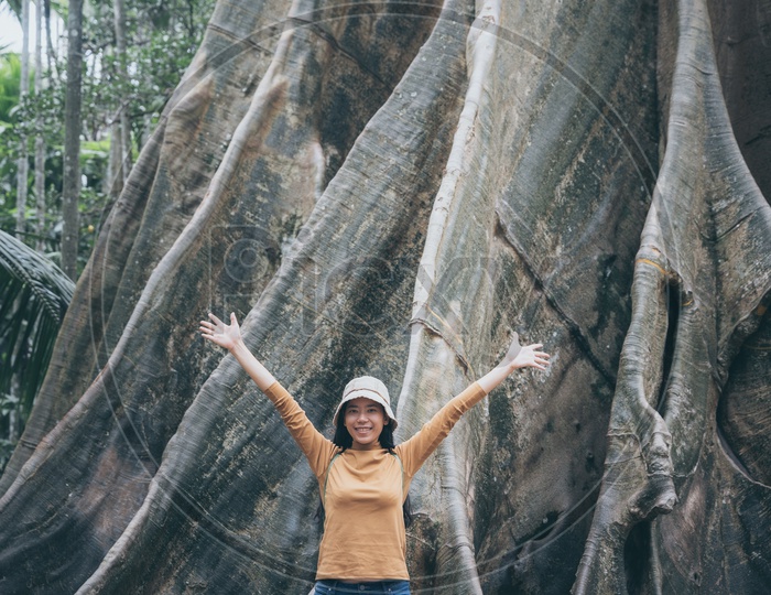 Asian woman spreading her hands in the air