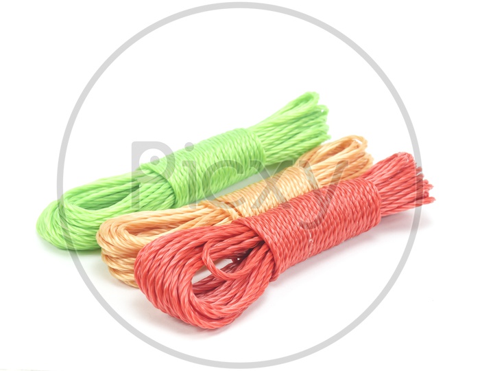 bundles of colorful nylon ropes on white background