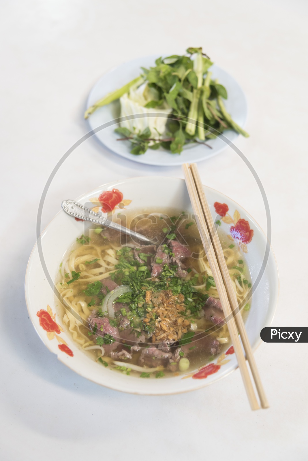 Pho Bo - Vietnamese fresh rice noodle soup served in a bowl