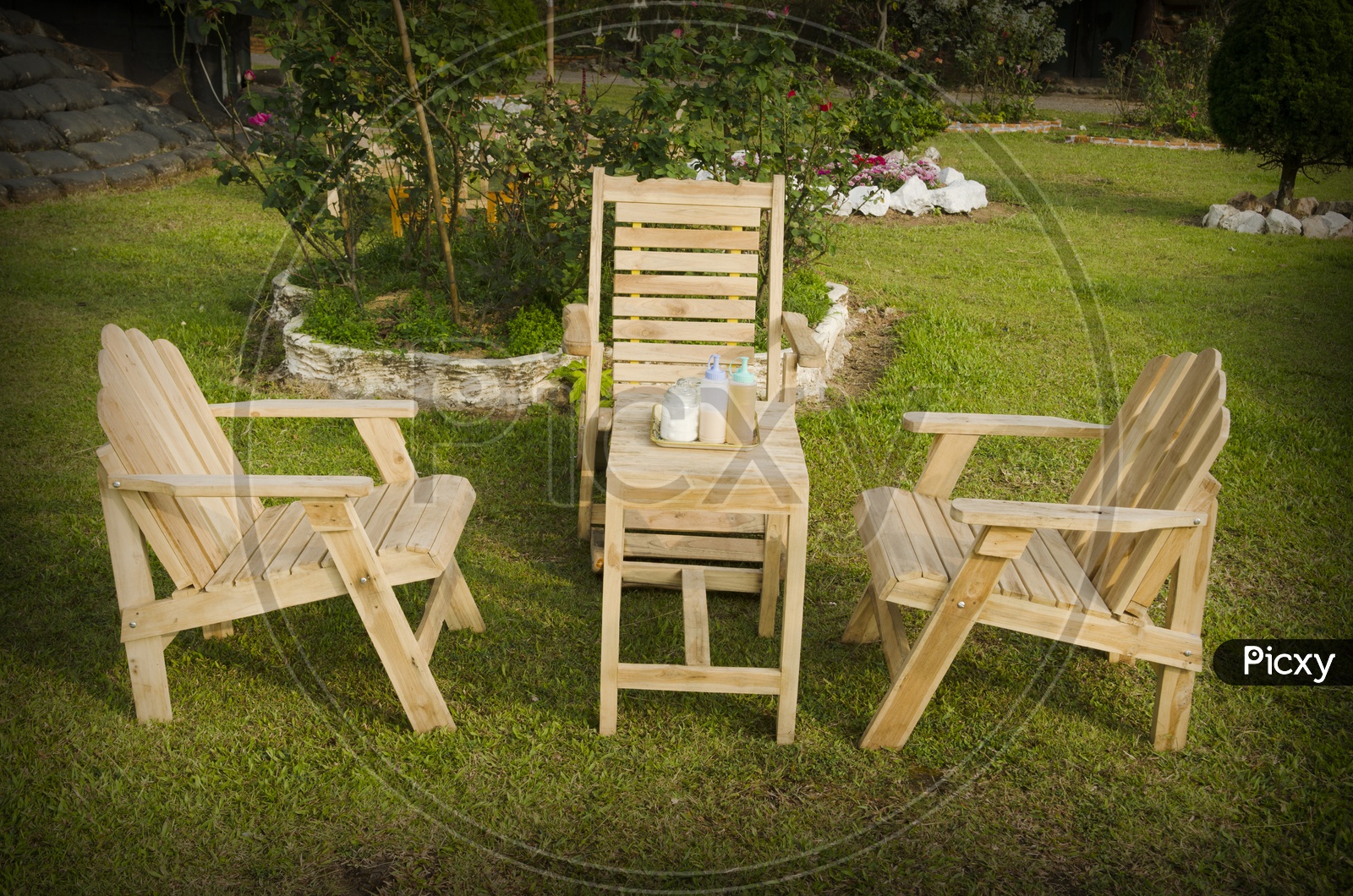 Wooden Chairs in English garden in summer
