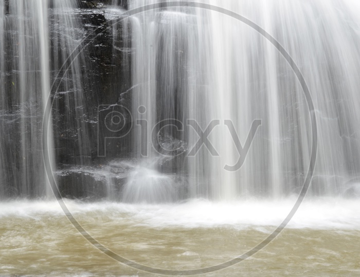 Long Exposure Shot of Erawan Waterfalls With Smooth Silky Texture Of Water Flowing