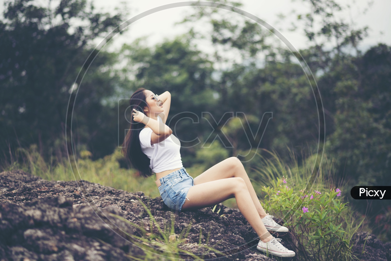 A beautiful Asian woman in the park during a photo-session