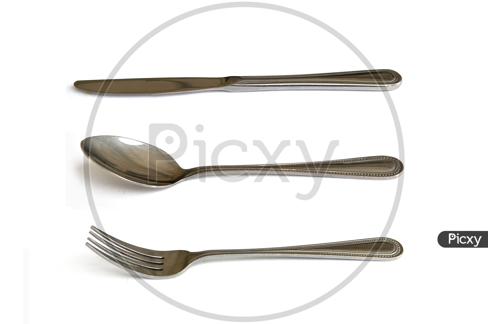 Cutlery: spoon, knife, fork. Isolated on white background