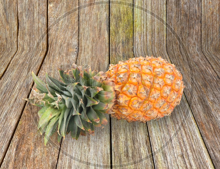 fresh pineapple on wood background