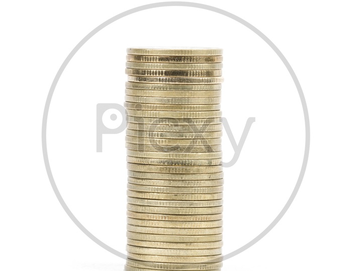 Currency Coins Column Over an Isolated White Background