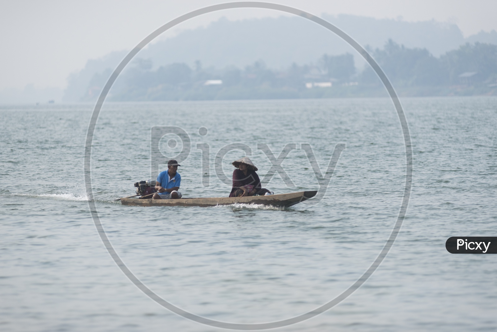 Unidentified people in a boat for crossing the border of Thailand and Laos at Ubon Ratchathani province in Thailand