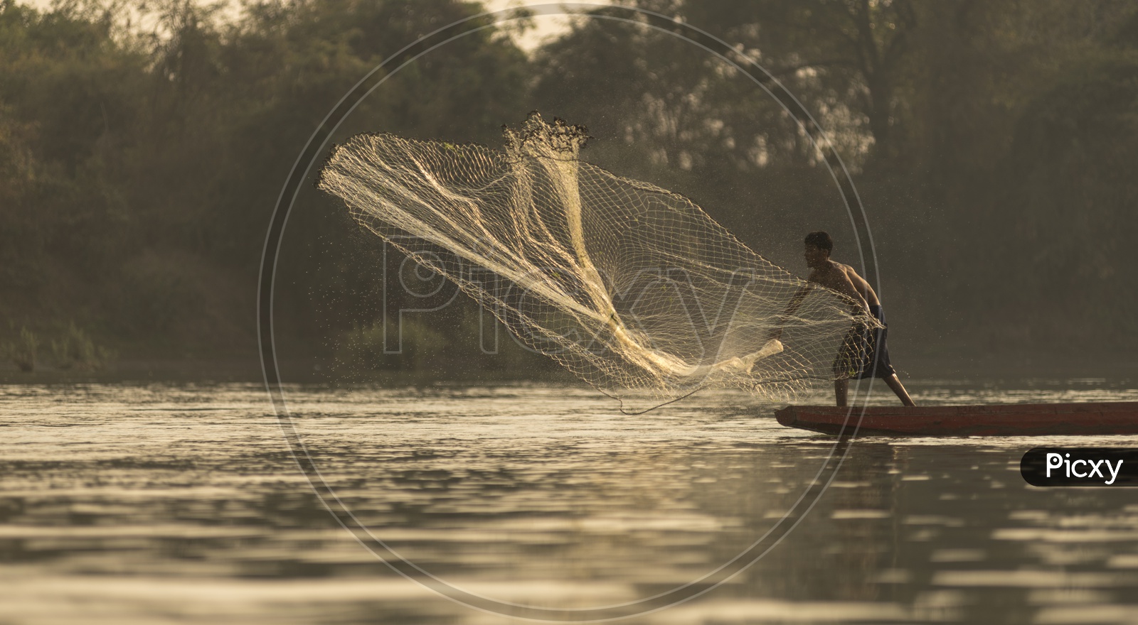 Fishermen along the banks of the Mekong river, Thailand and Laos.