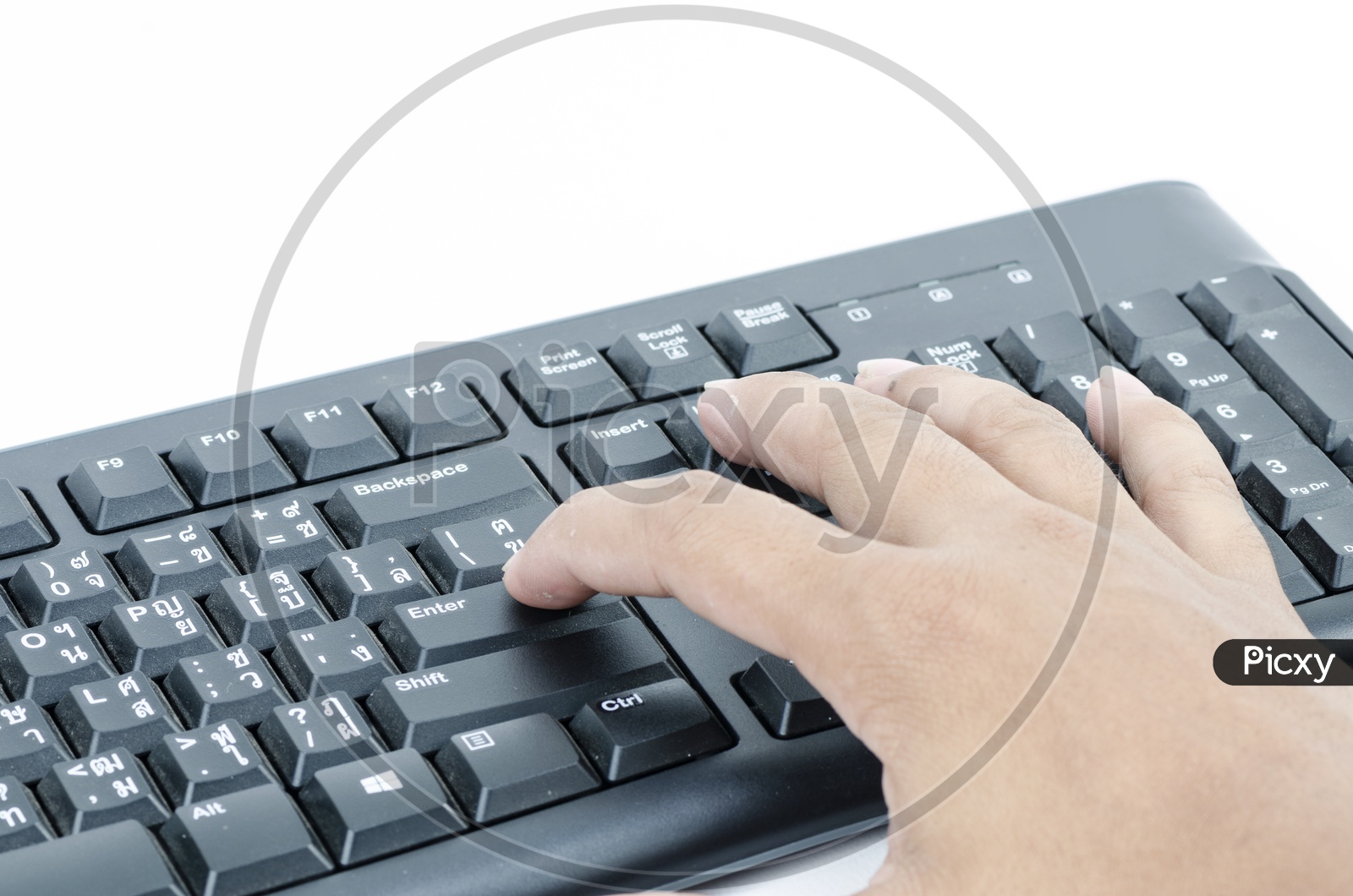 Young Man Finger Pressing Enter Button in a Keyboard