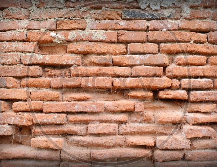 Weathered stained old brick wall
