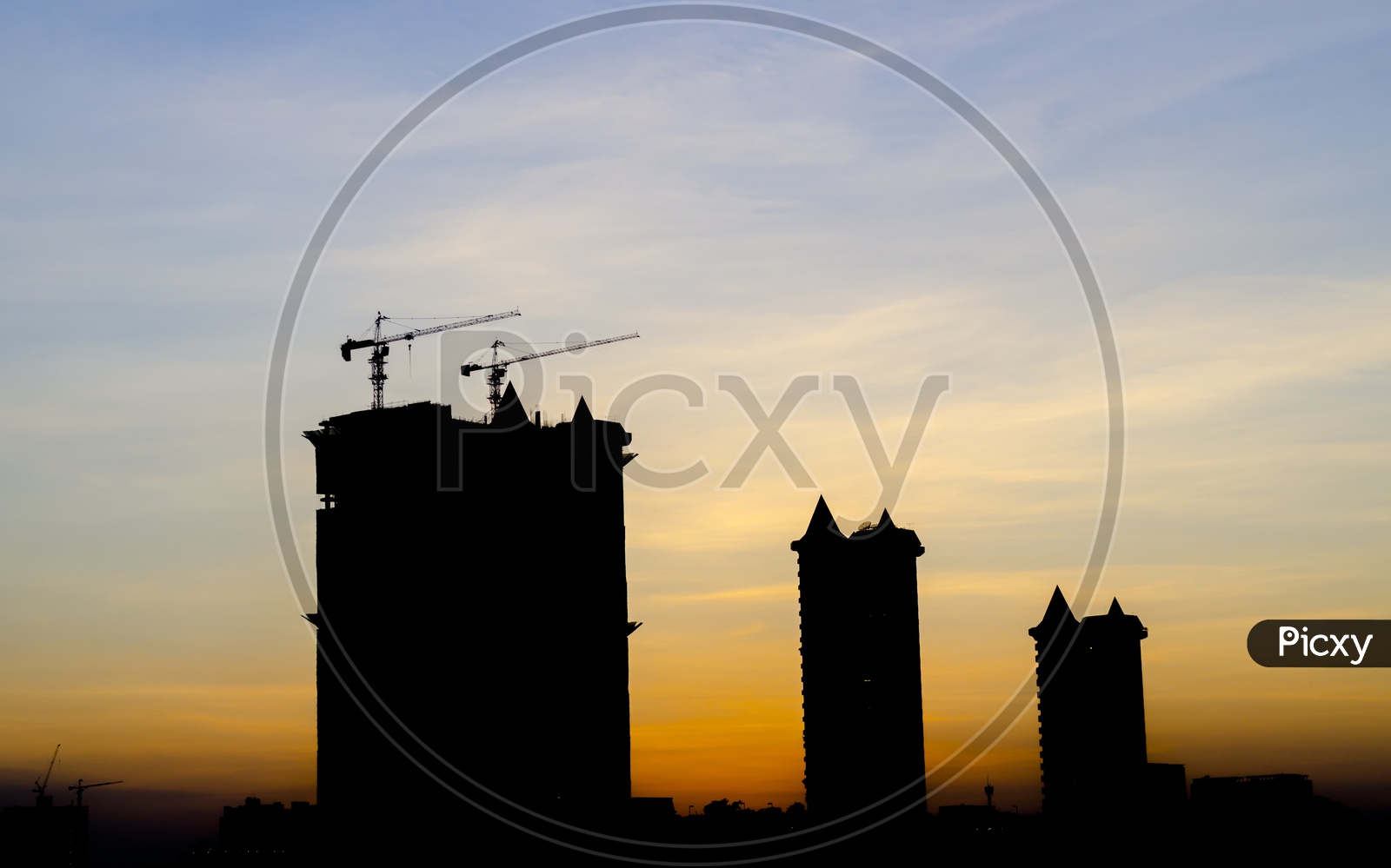 Construction project silhouette during sunset