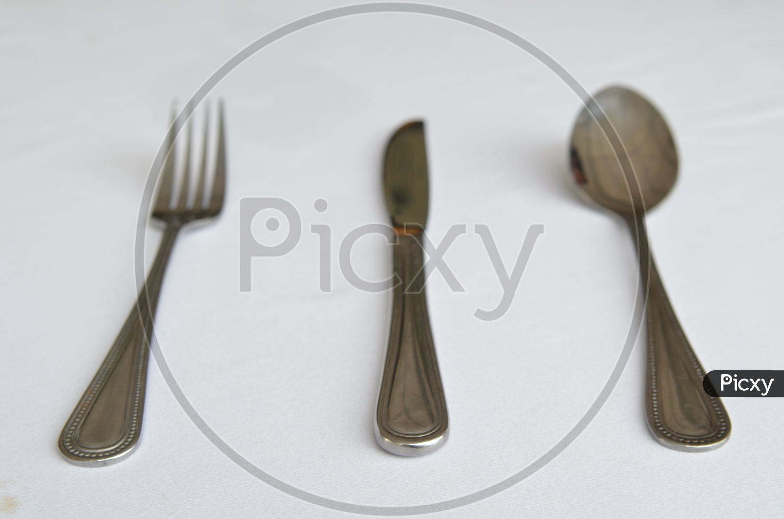 Fork , Spoon and Knife on a Restaurant Dining Table