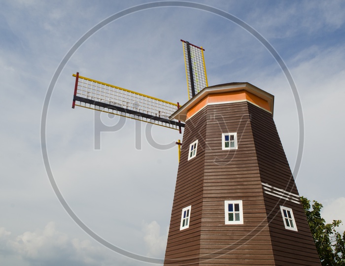 Traditional Dutch windmill with blue sky