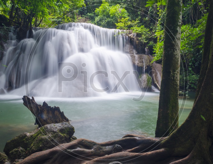 Long exposure of Deep forest waterfall at Erawan waterfall National Park Kanjanaburi Thailand