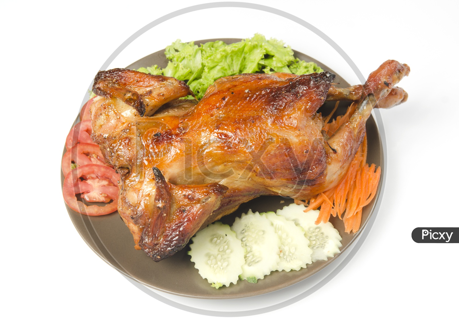 whole grilled chicken served with vegetable