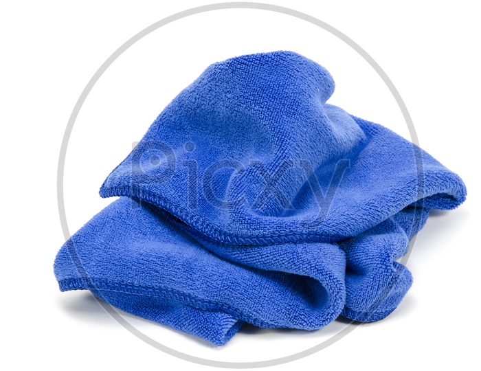 Crumpled blue microfiber cloth isolated on white background