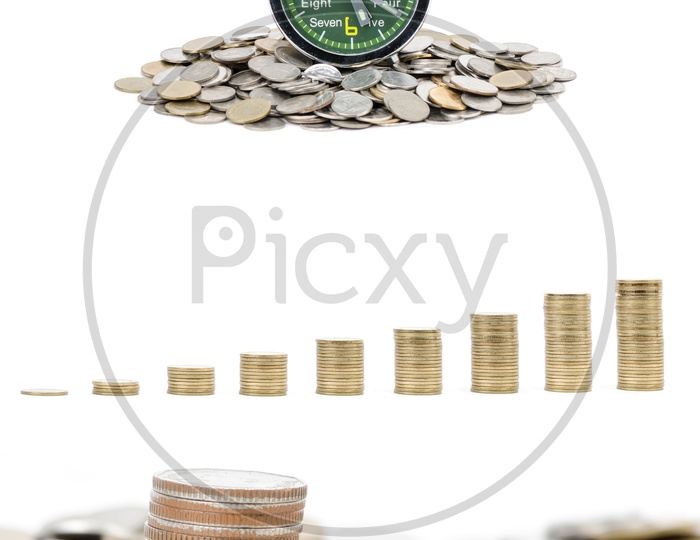 Alarm Clock With Currency Coins Mount On an Isolated White Background