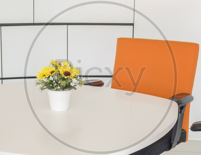 A Modern office room decorated with flower vase