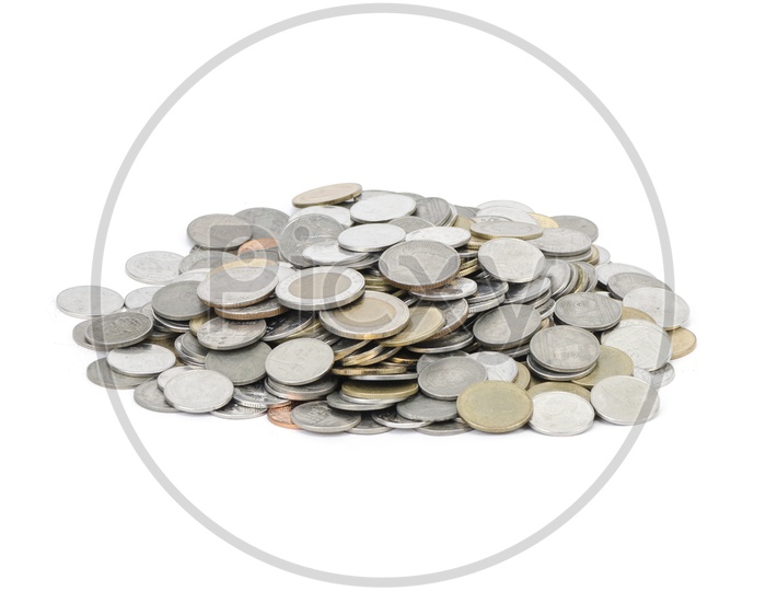 Currency Coins Pile Over An Isolated White Background