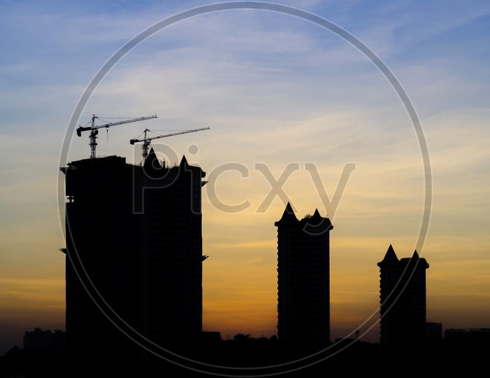 Silhouette of Thai Tower cranes during sunset