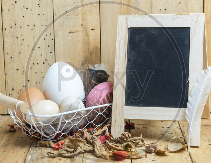 Easter Festival Creative Backgrounds with Easter Eggs over Wooden Background