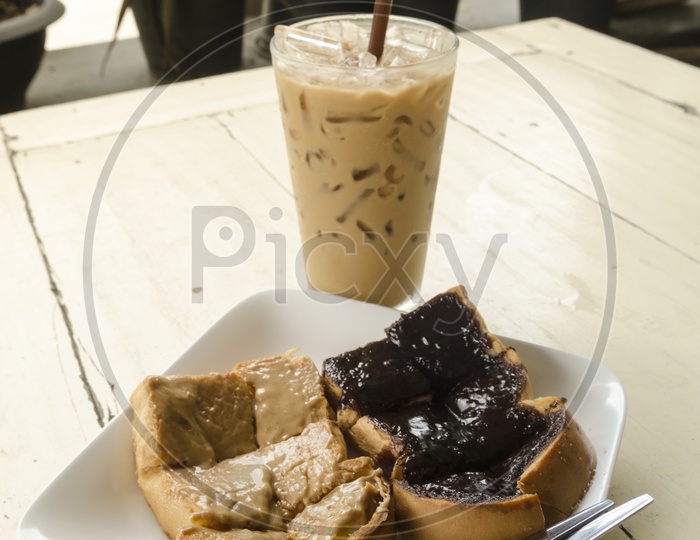 Ice coffee with Chocolate spread bread in a Thai Cafe