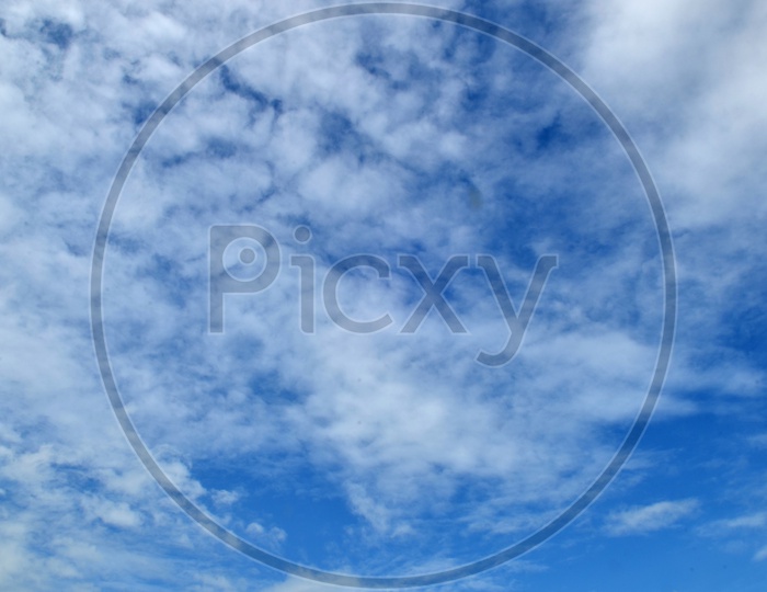 Abstract of Blue Sky With Cotton Clouds