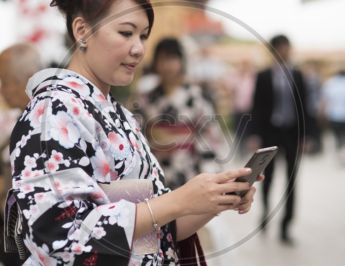 A Japanese woman using cellphone
