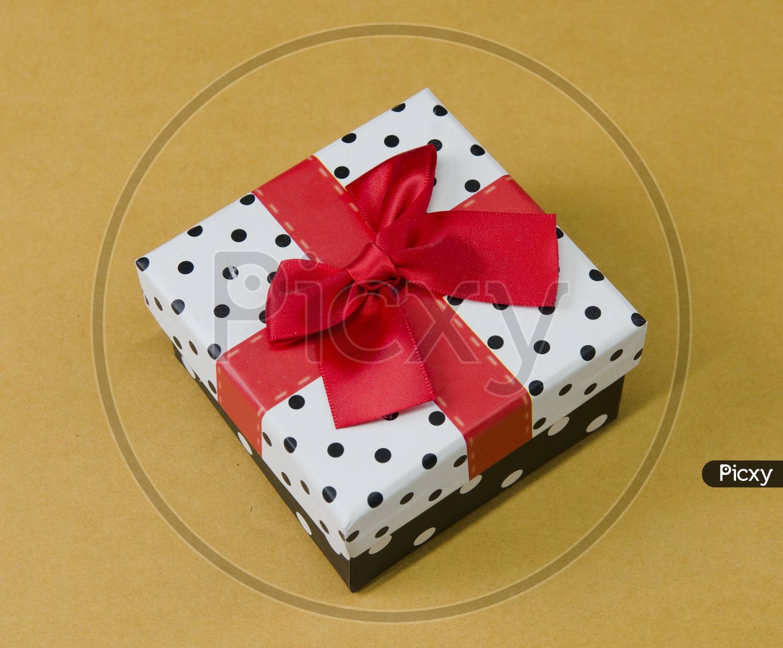 A Polka dots gift box with ribbon