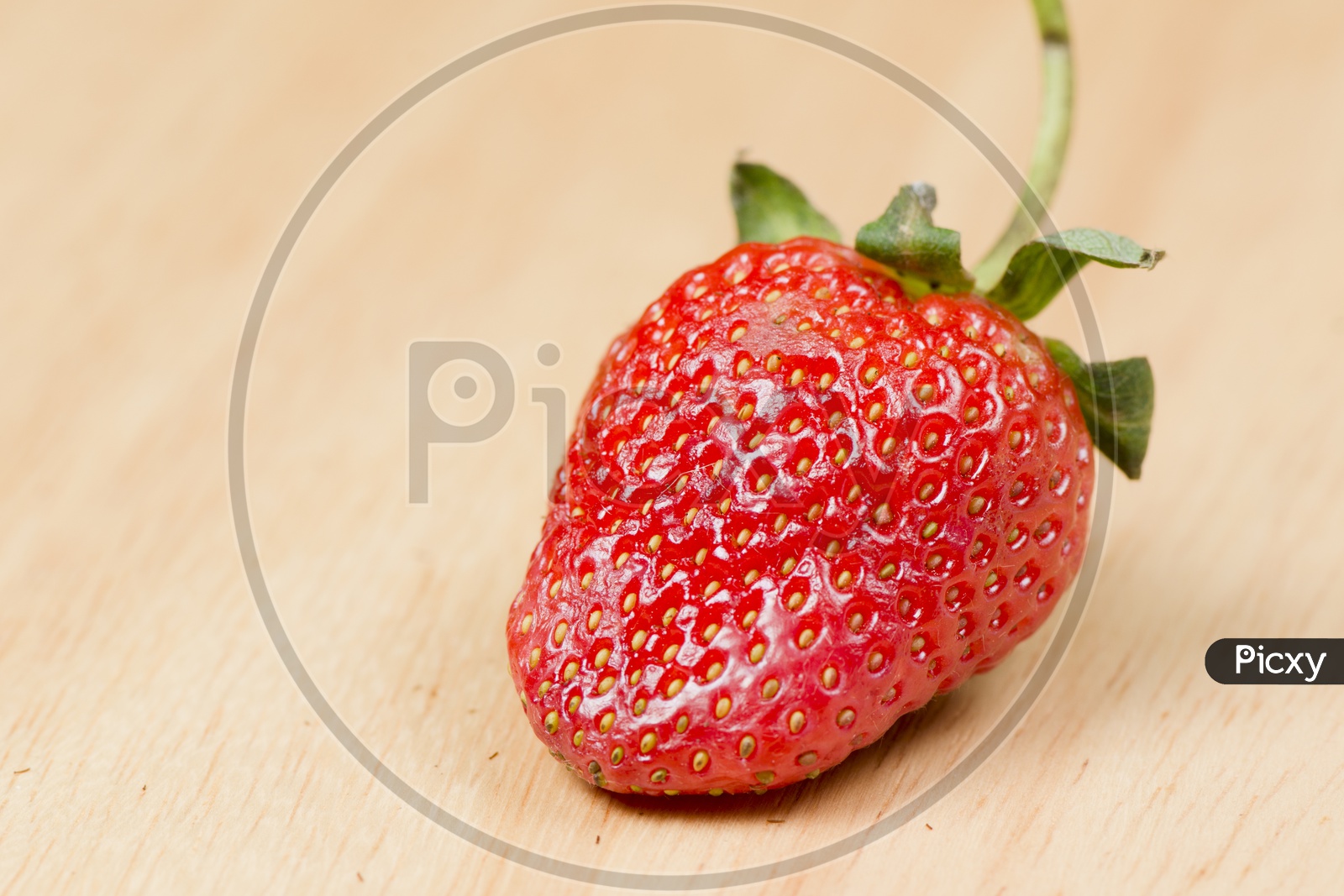Closeup Shot of Fresh Strawberry on Wooden Background