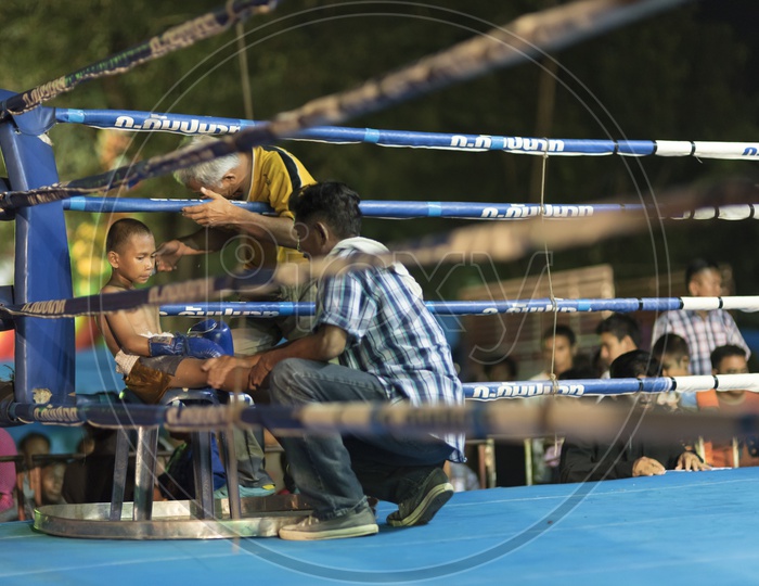 A Young Thai boxing player in the ring