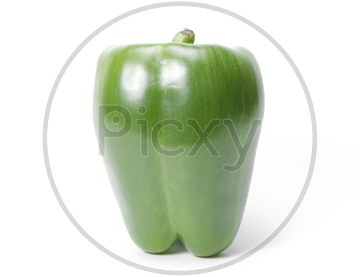 green capsicum or sweet pepper on white background
