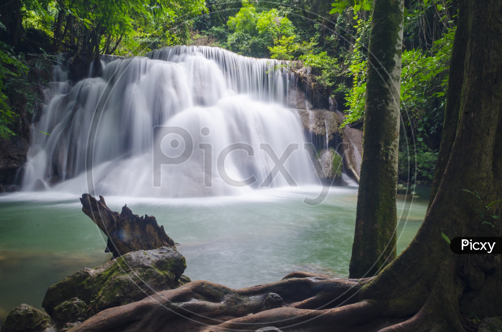 Long exposure of Deep forest waterfall at Erawan waterfall National Park Kanjanaburi Thailand