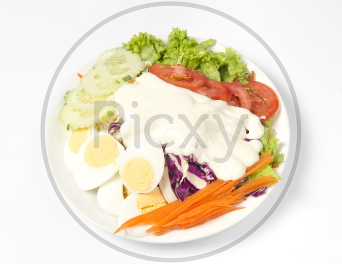 Vegetable salad in Plate isolated on white background
